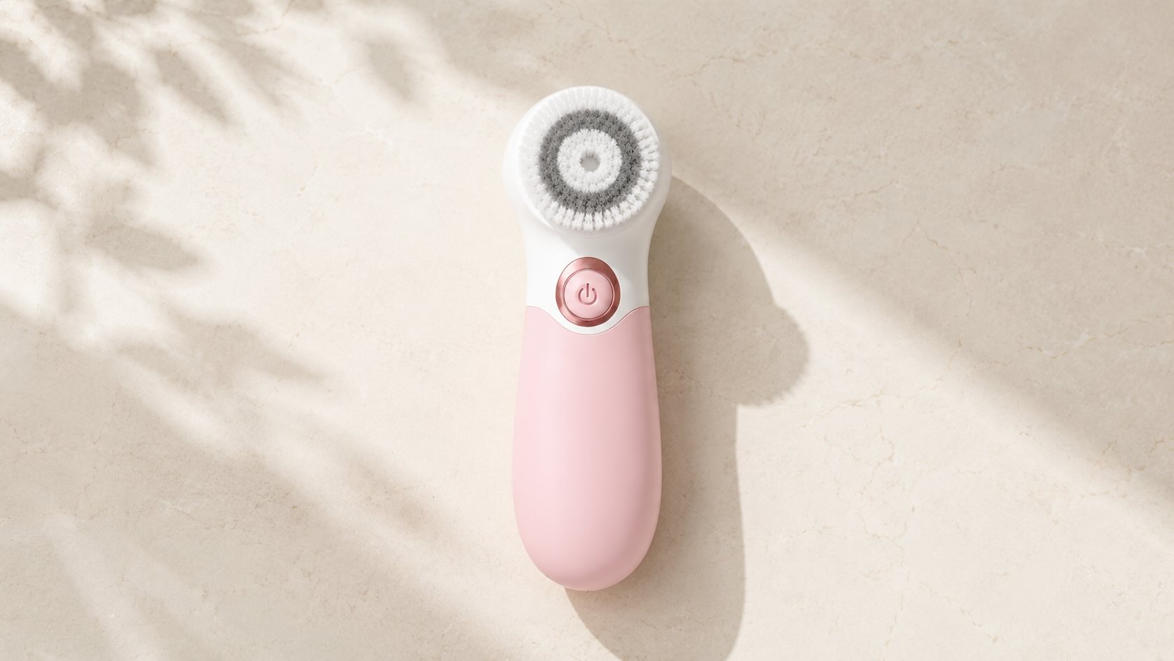 TOUCHBeauty Facial Cleansing Brush device on neutral cream background with minimalist beauty-tech styling