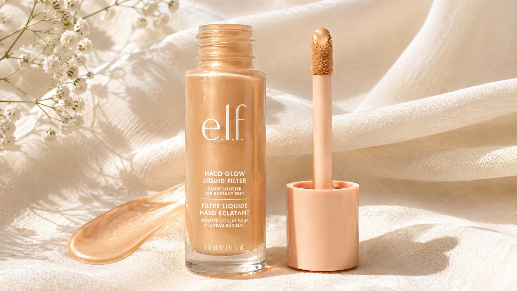 e.l.f. Halo Glow Liquid Filter dropper bottle on neutral cream background showing pearlescent formula
