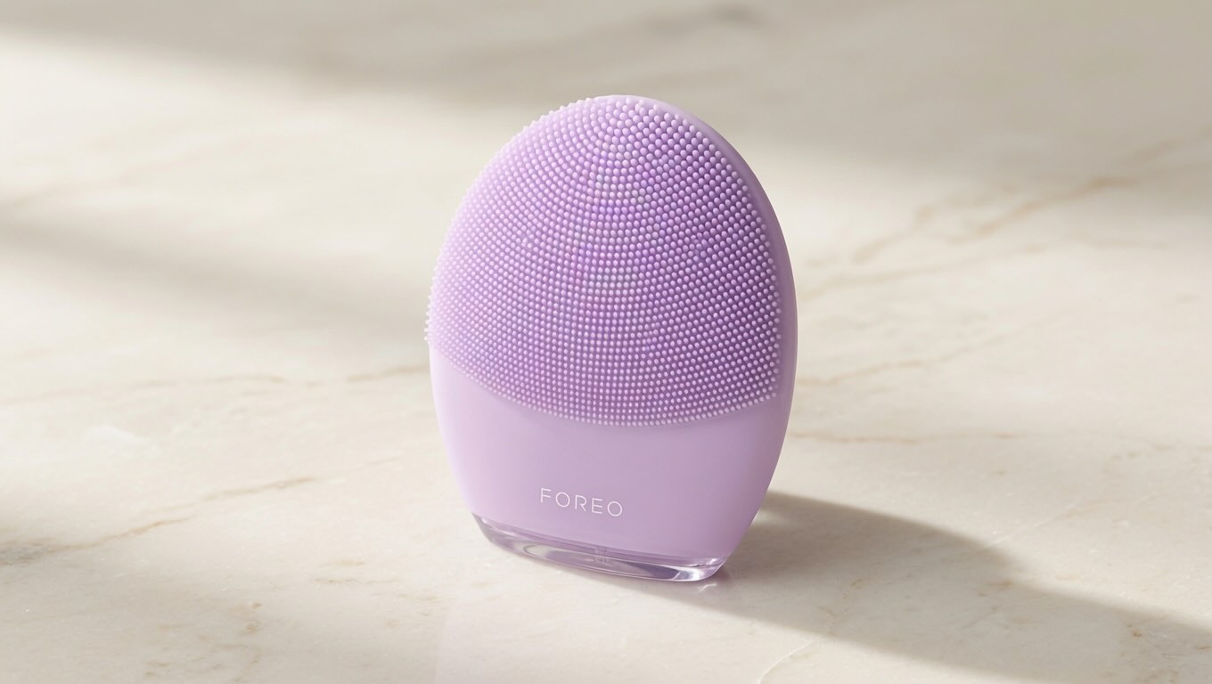 FOREO LUNA 4 Face Massager lilac silicone device on neutral cream surface