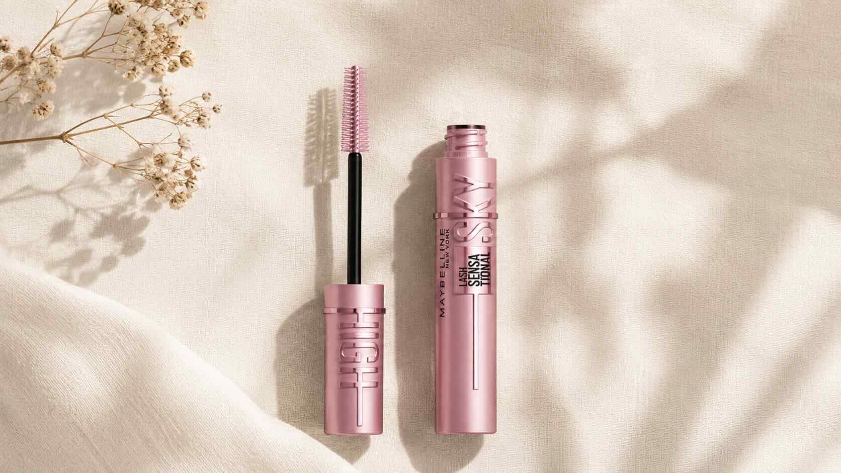 Maybelline Lash Sensational Sky High Mascara blue tube on neutral cream background