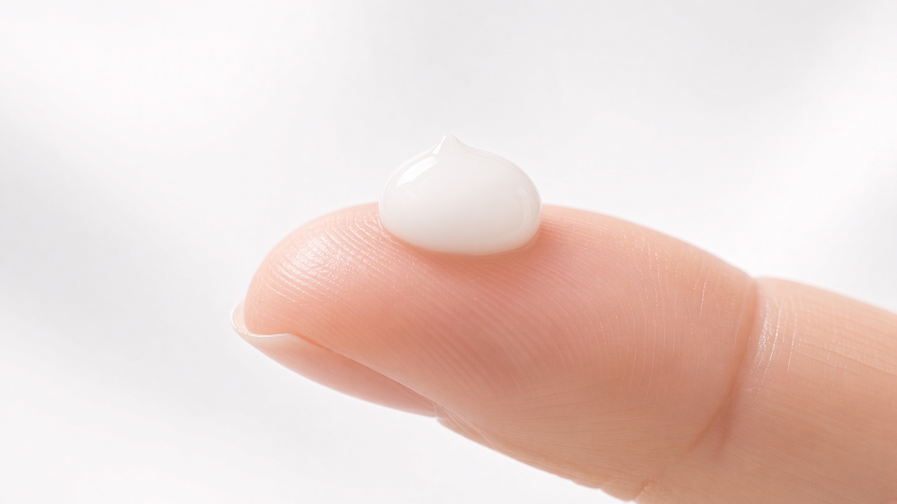 Differin Adapalene Gel 0.1% texture on fingertip showing the clear lightweight gel formula