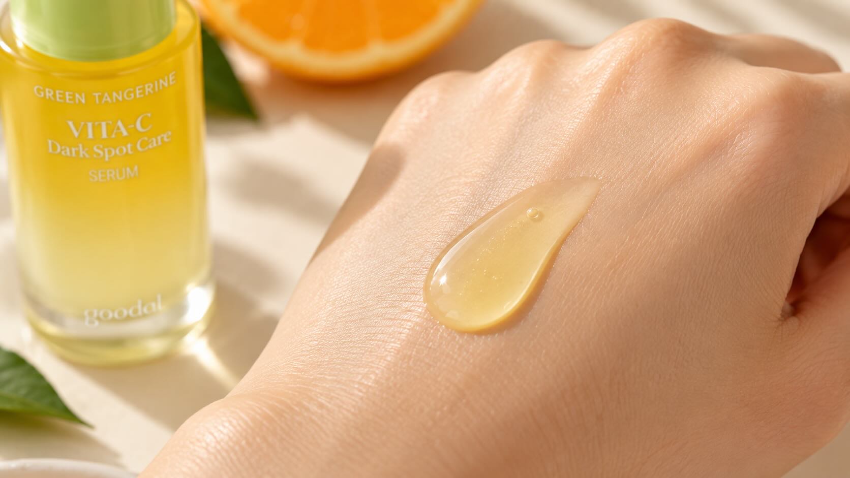 Goodal Green Tangerine Vita C Serum lightweight citrus-tinted serum texture on the back of a hand