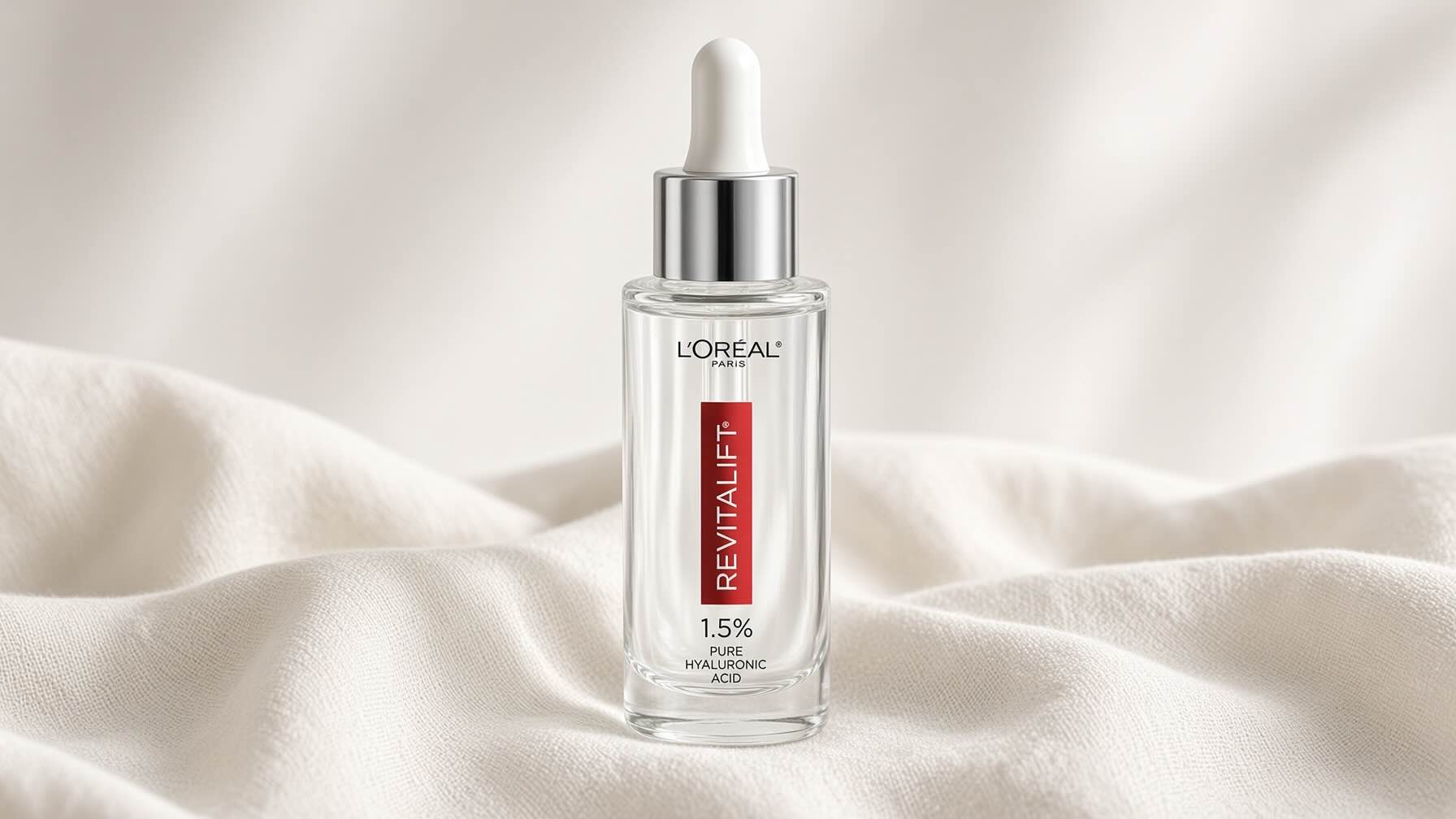 L'Oréal Paris Revitalift 1.5% Pure Hyaluronic Acid Serum on neutral cream background with fall skincare styling